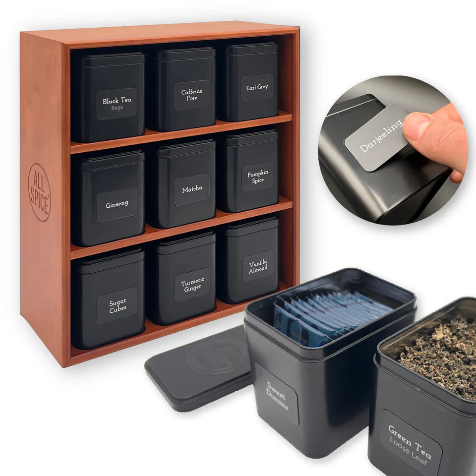 Tea storage set with cherry stain  wooden organizer and black containers labeled with tea types.